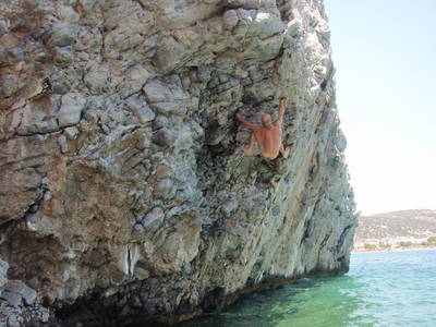 nude rockface aegean sea climber