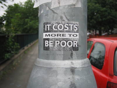 label graffiti it costs more to be poor lamppost