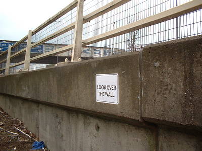 fly poster graffiti look over the wall banksy m bristol