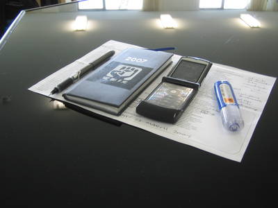 still life photography pen diary mobile phone tipex