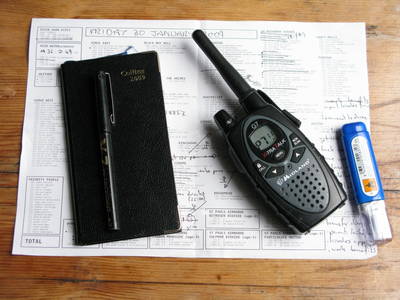 still life photography pen diary walkie talkie tipex