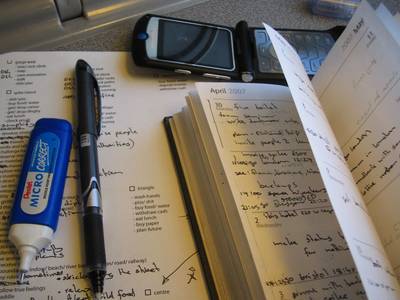 still life photography tipex pen diary mobile phone