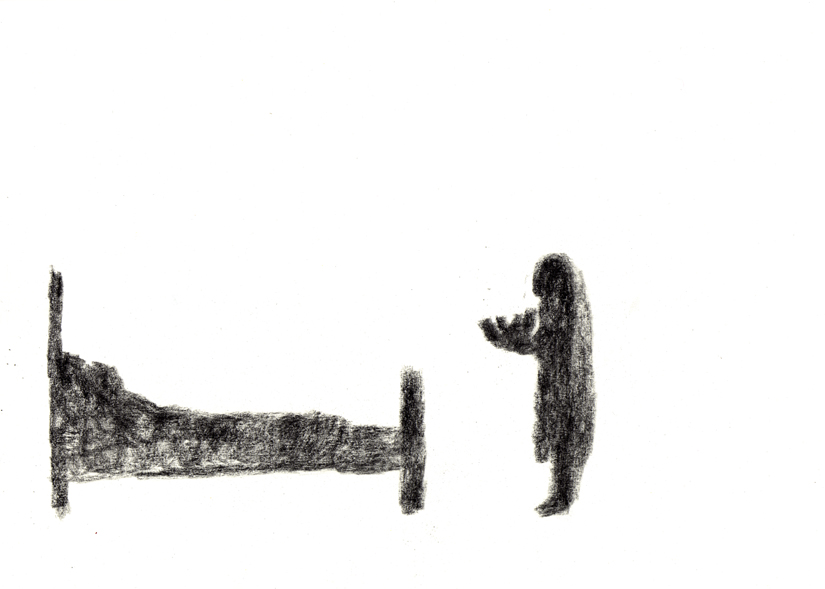 A woman in black carrying a child